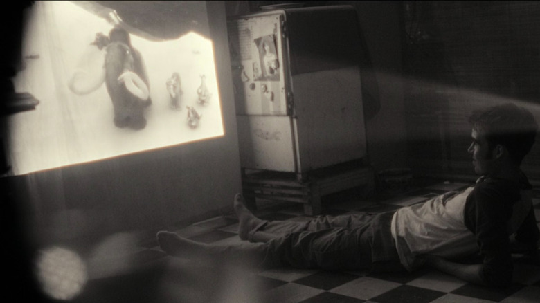 Joe watching "Ice Age: Continental Drift" on "Alien: Earth" (2025)