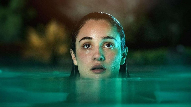 Reese in her swimming pool in Bad Influence (2025)