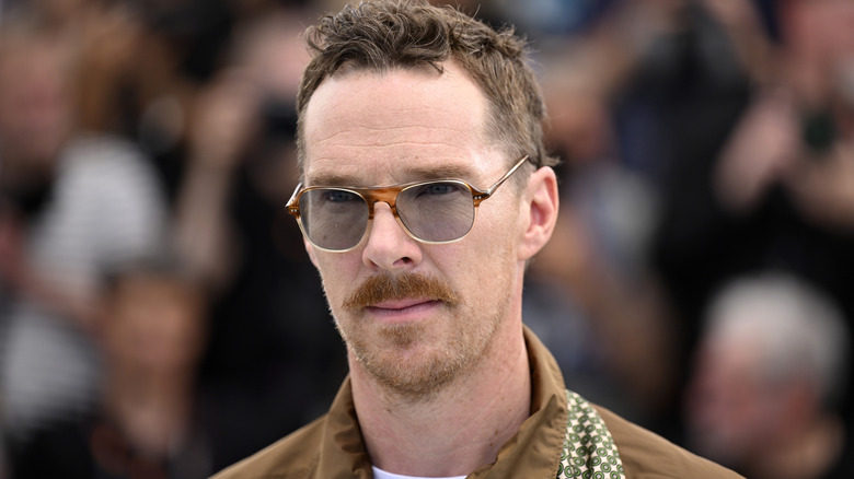 Benedict Cumberbatch on the red carpet, wearing sunglasses.