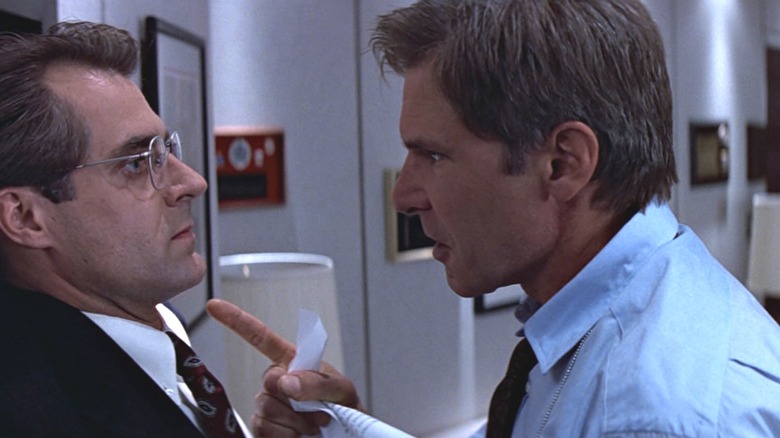 Ryan confronts the secretary of defense, wagging a finger in his face in Clear and Present Danger (1994)
