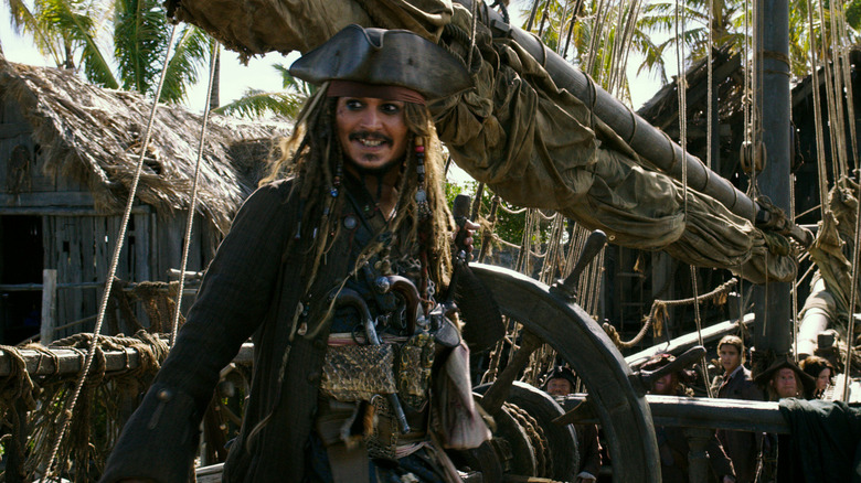 Jack Sparrow smiles on the deck in "Pirates of the Caribbean: Dead Men Tell No Tales" (2017)