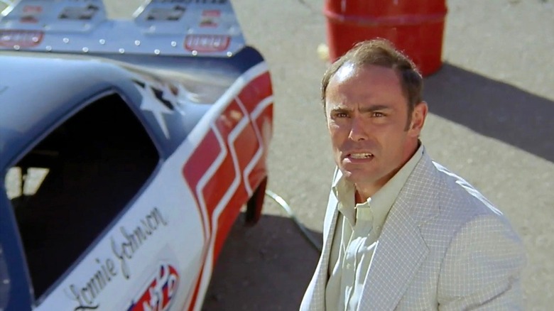 Phil Adamson approaches a race car in "Fast Company" (1979)