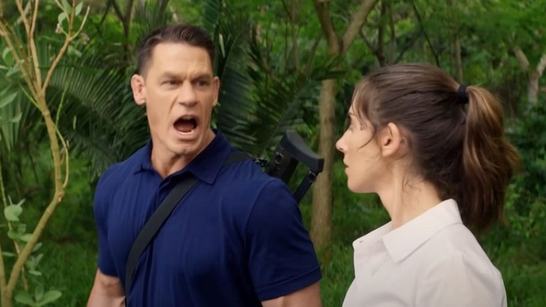 Mason and Claire walk through the jungle in "Freelance" (2023)
