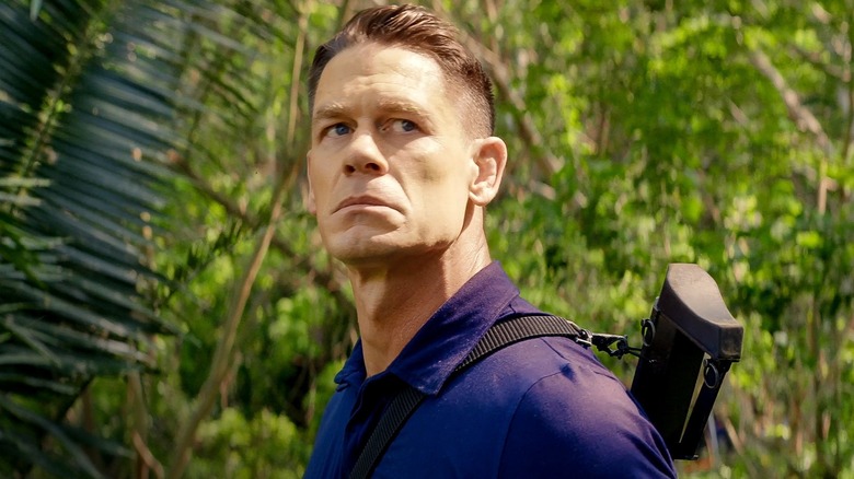 Mason in the woods, looks up into the sky in "Freelance" (2023)
