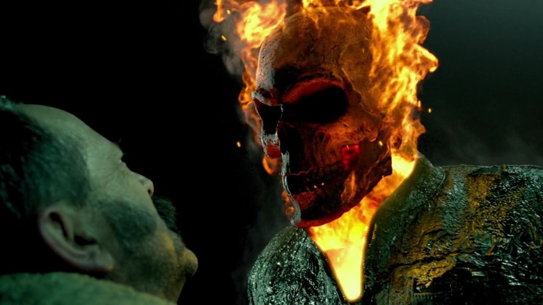 Ghost Rider with his flaming skull confronting an enemy