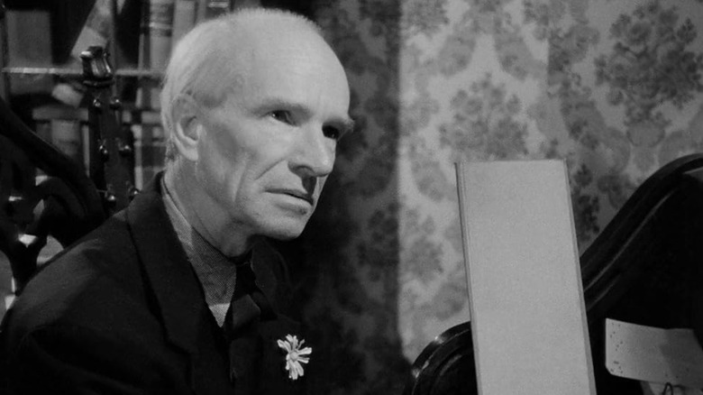 Ian Wolfe signing a guestbook in They Live by Night