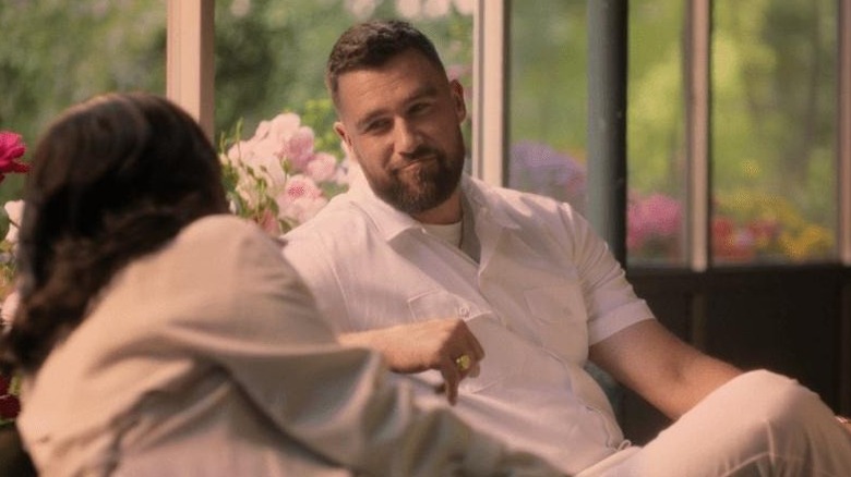 Ed sitting and talking to a woman in "Grotesquerie" (2024)