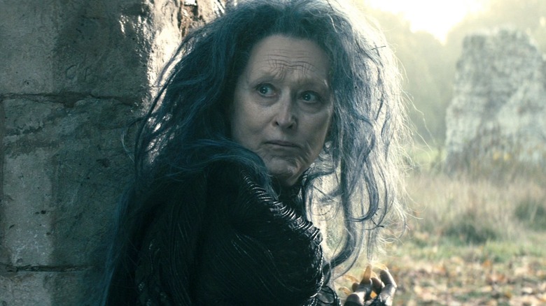 The witch looks over her shoulder in "Into the Woods" (2014)