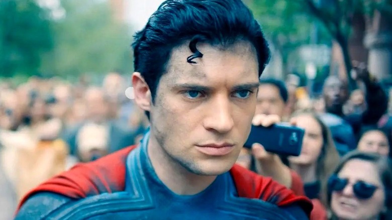 Superman surrounded by onlookers in "Superman" (2025)