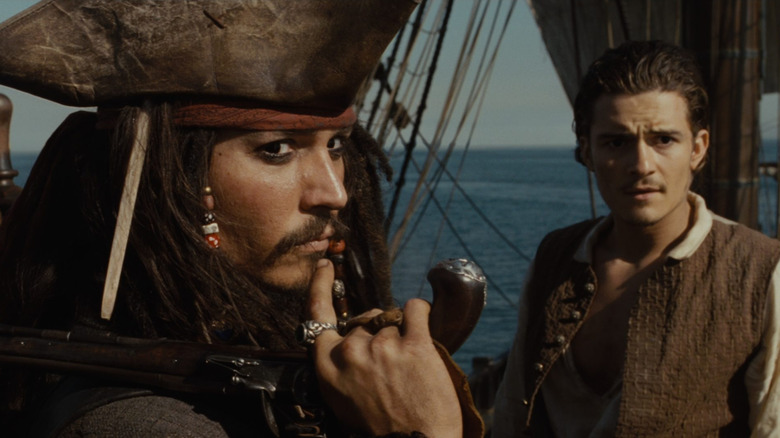 Jack Sparrow and Will Turner on the deck in "Pirates of the Caribbean: The Curse of the Black Pearl" (2003)