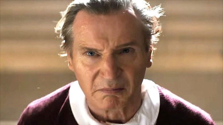 Frank Drebin Jr. scowls in his schoolgirl disguise in "The Naked Gun" (2025)
