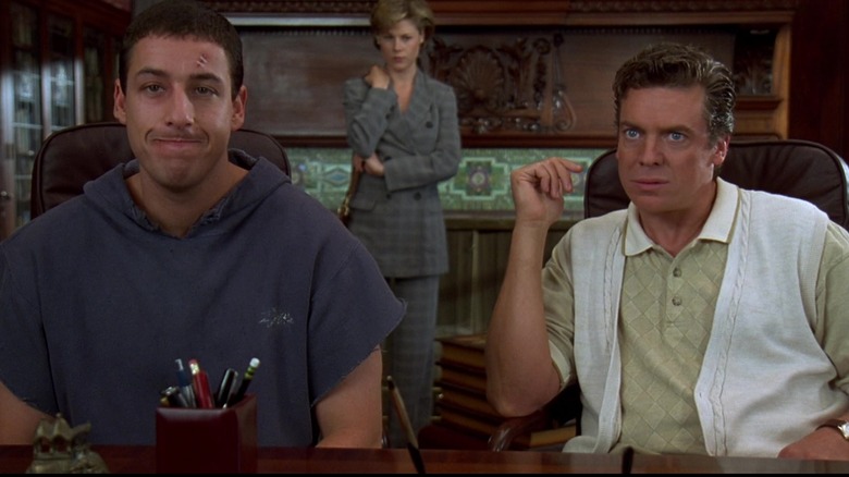 Virginia looks on as Happy and Shooter sit at a desk in "Happy Gilmore" (1996)