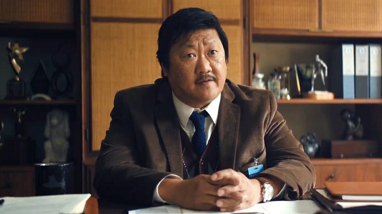 Marcus sits at his desk in "Weapons" (2025)