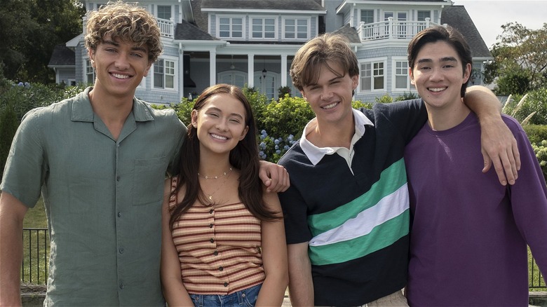 Jeremiah, Belly, Conrad, and Steven posing for photo in "The Summer I Turned Pretty" Season 2