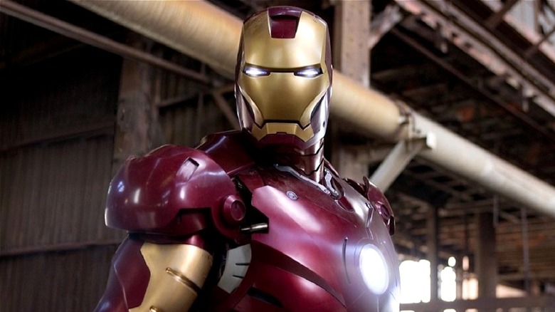 Iron Man with steel girders behind him in "Iron Man" (2008)