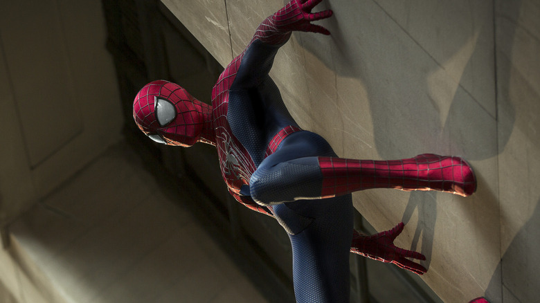 Spider-Man crawls up a wall in "The Amazing Spider-Man 2" (2014)