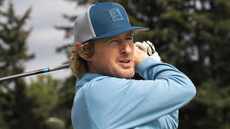 Pryce Cahill finishes a drive in a blue hat and shirt in "Stick" (2025)