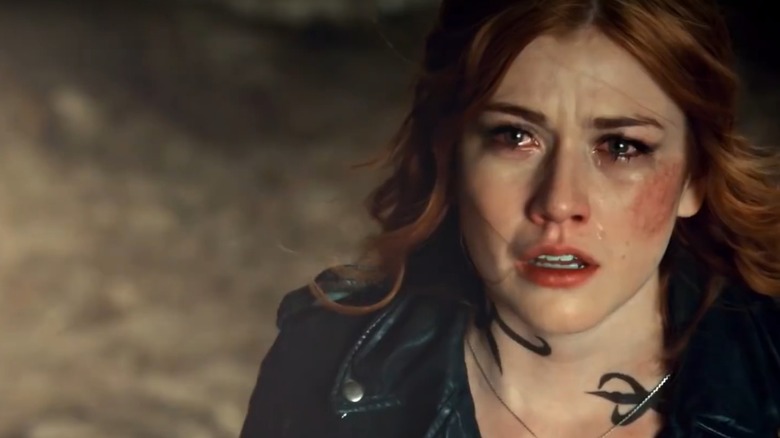 Teary-eyed Clary looking up at the sky in The Mortal Instruments: City of Bones (2013)