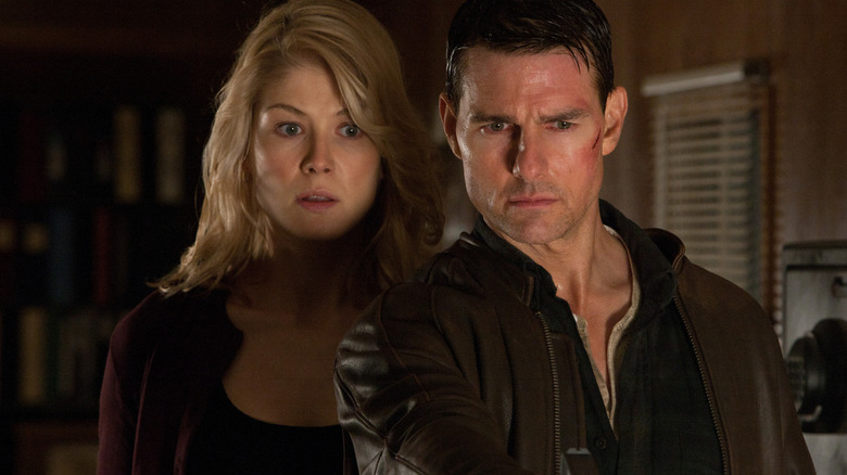 Helen stands behind Reacher in shock in "Jack Reacher" (2012)