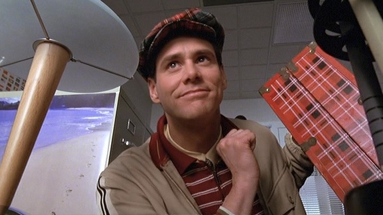 Truman Burbank prepares for a trip in "The Truman Show" (1998)