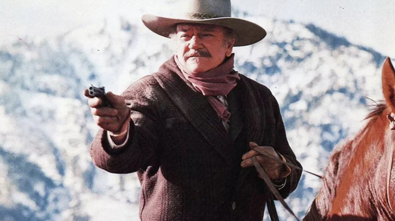 J.B. Books on horseback with a gun in "The Shootist" (1976)