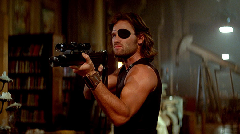 Snake Plissken aims a big gun in "Escape from New York" (1981)