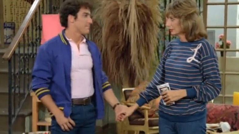 Laverne and Carmine holding hands, looking at each other in "Laverne and Shirley"