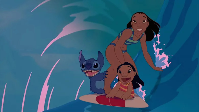 Stitch, Lilo, and Nani surf in Lilo & Stitch (2002)