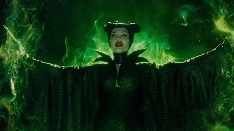 Maleficent standing in green fire in "Maleficent" (2014)