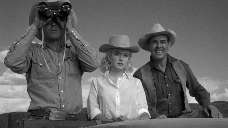 Perce, Roslyn, and Gaylord look at the open range in "The Misfits" (1961)