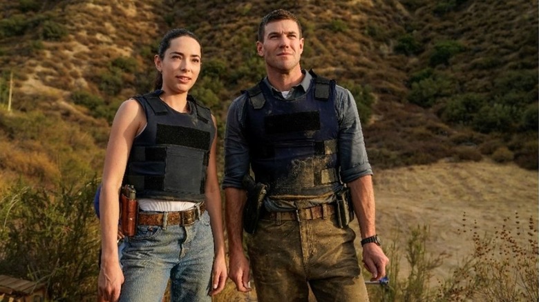 Jethro and Cecilia stand on a hill overlooking the city in "NCIS: Origins" (2024-present)