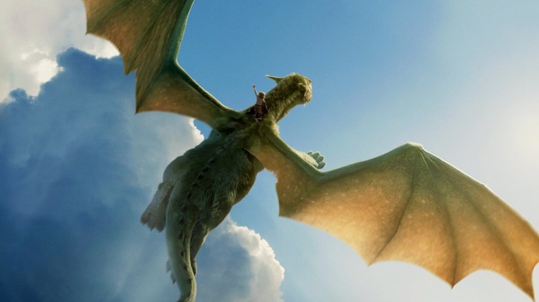 Pete flies on Elliott in Pete's Dragon (2016)
