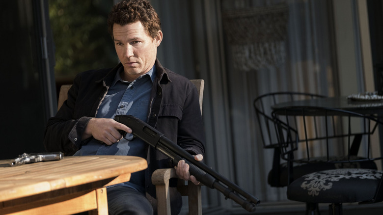 Pope waits with a gun in "Animal Kingdom" (2016-2022)
