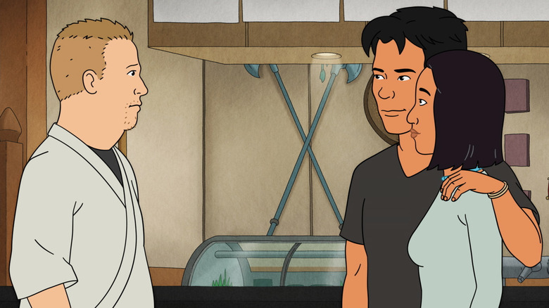 Chase puts his arm around Connie in front of Bobby in "King of the Hill"