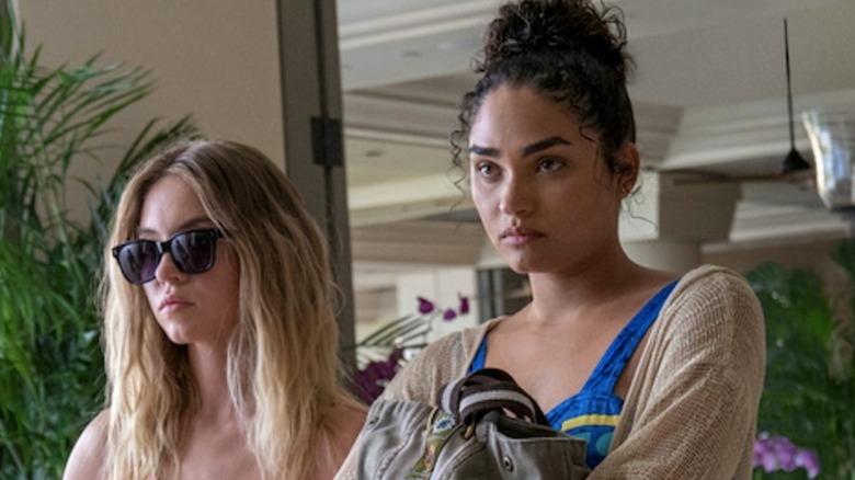 Olivia and Paula standing together in "The White Lotus" (2021)