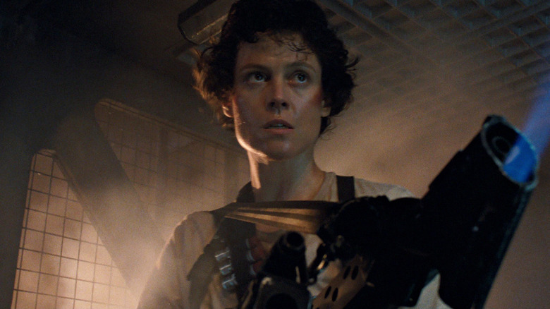 Ripley holds a flamethrower in "Aliens" (1986)