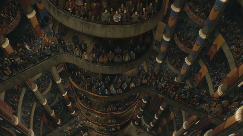 People looking up from platforms in the silo in "Silo"