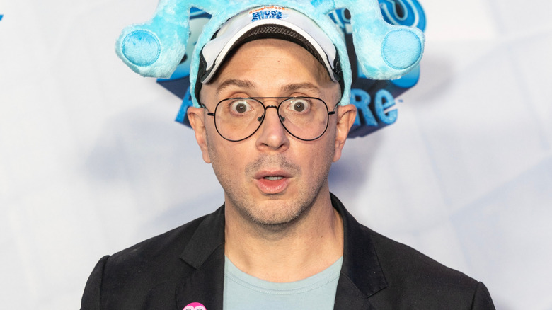 Steve Burns wide-eyed in front of white background