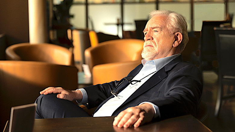 Roy leans back in a chair in Succession