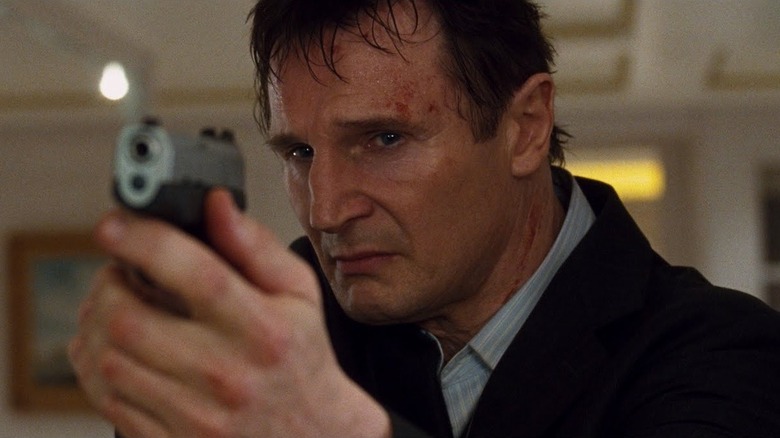 Mills aims a gun in Taken (2008)