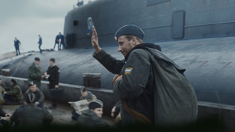 Captain Averin waves near a submarine in "The Command" (2018)