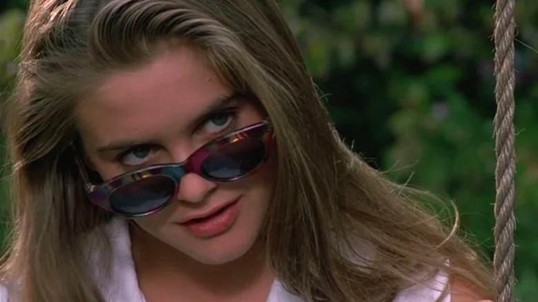 Adrian looks seductively over the top of her sunglasses in The Crush (1993)