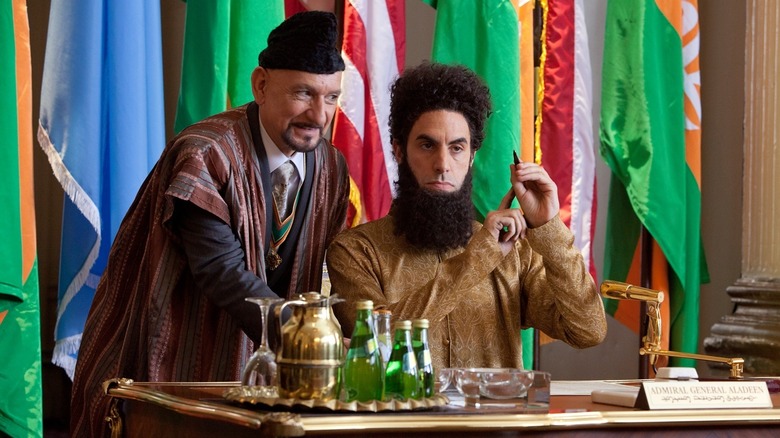 Tamir leaning over Aladeen in The Dictator