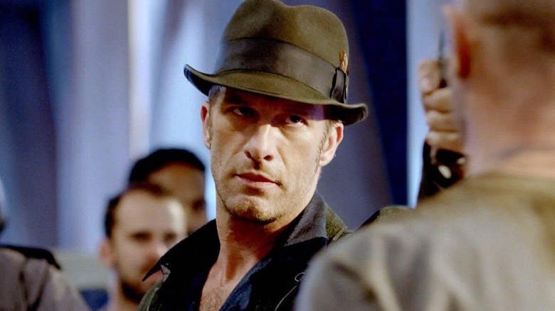 Joe points a gun at someone in "The Expanse" (2015-2022)
