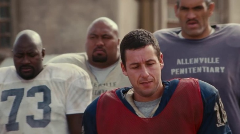 Paul walks with teammates behind him in "The Longest Yard" (2005)