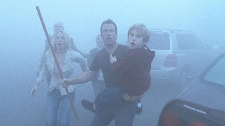 David, his son Bill, and others looking into the mist in "The Mist" (2007)