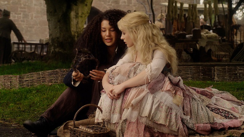 Sophie and Agatha sit together in "The School for Good and Evil" (2022)