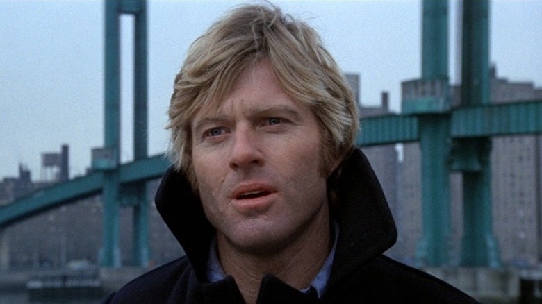Turner stands in front of the city skyline in Three Days of the Condor (1975)