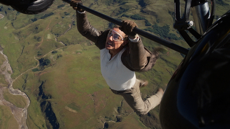 Ethan Hunt hangs from a plane in "Mission: Impossible -- The Final Reckoning" (2025)