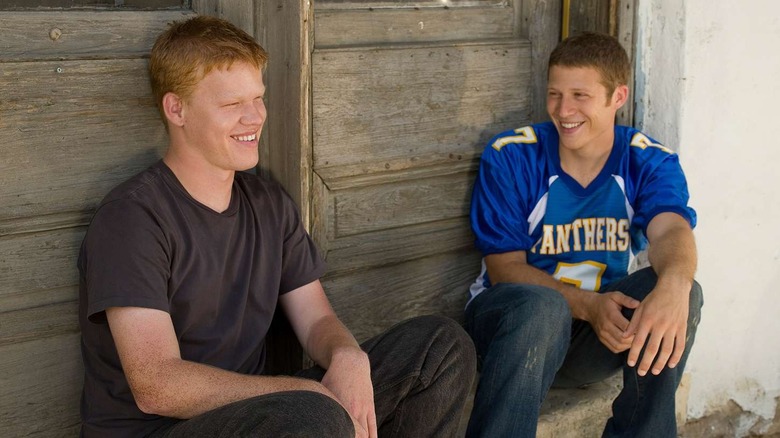 Landry and Matt sitting and smiling in "Friday Night Lights."